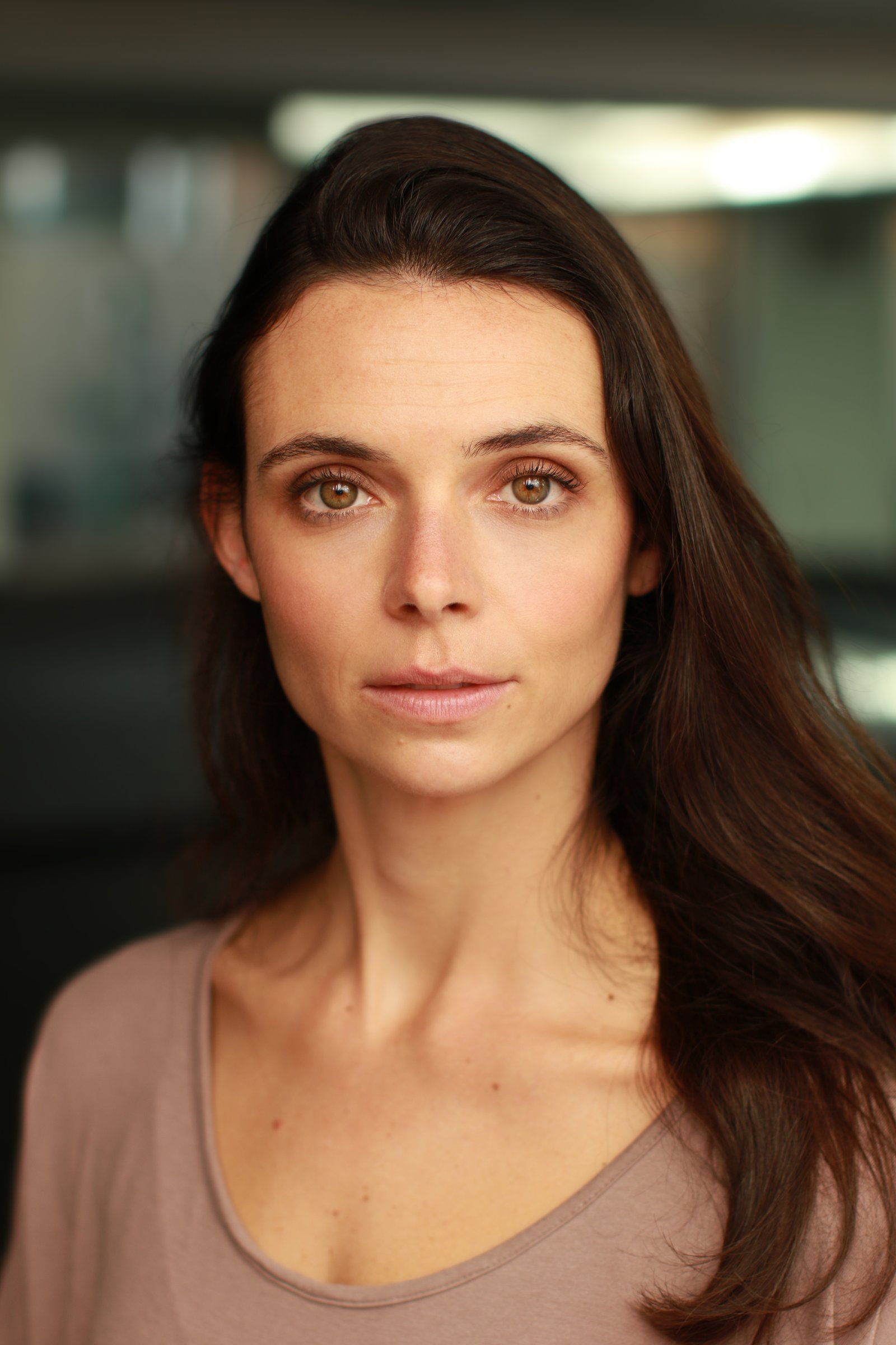 Sarah Hirsch headshot — hair down, mauve top